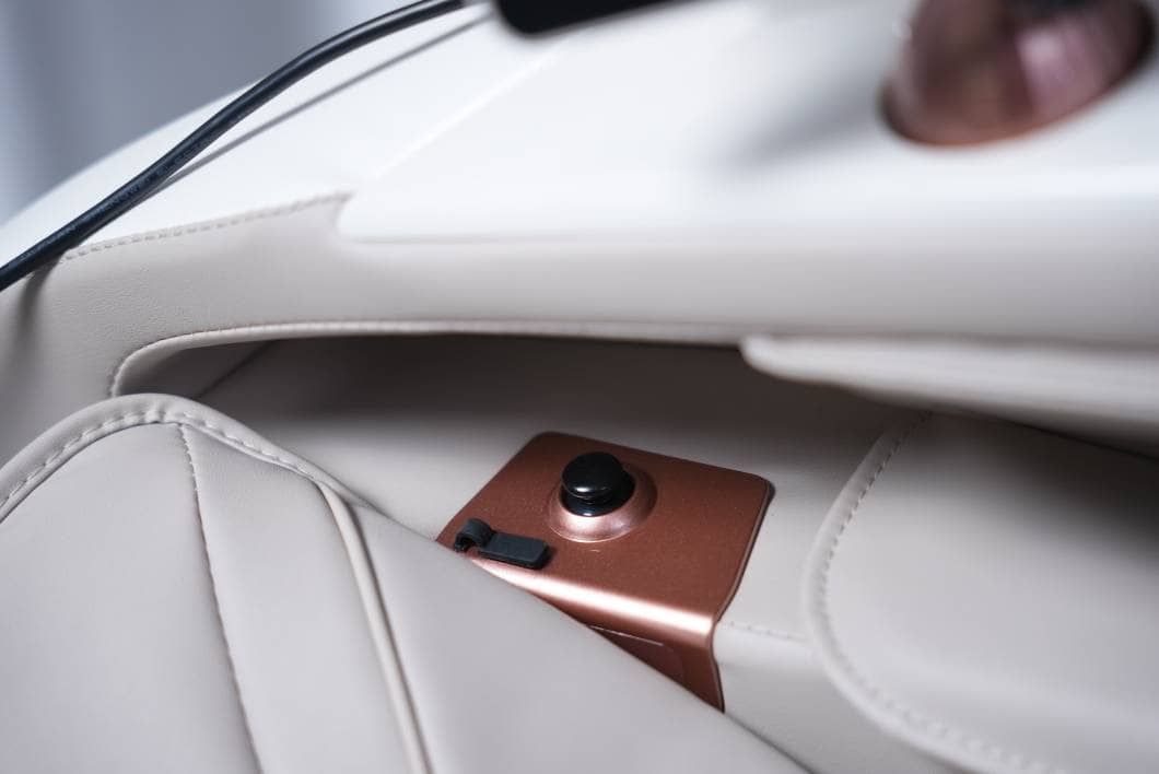 Rose-gold side panel and soft upholstery detail